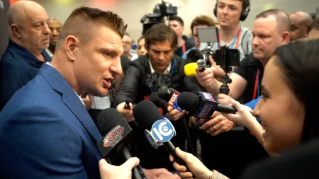Reporters interview analyst and retired NFL star Rob Gronkowski.
