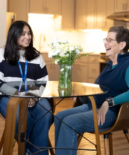 Resident and Student laughing