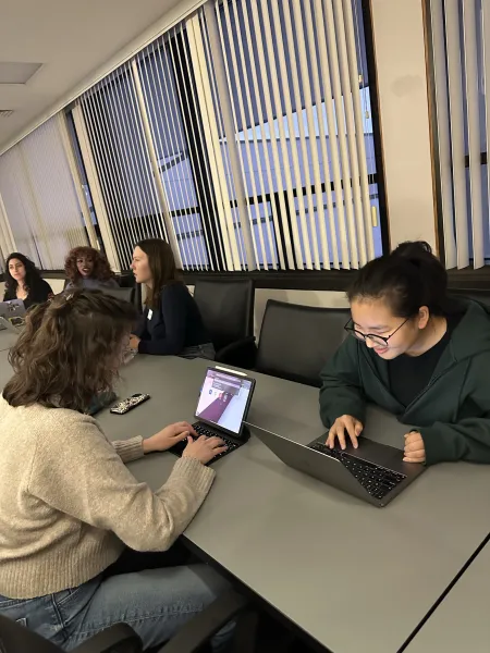 College students working on laptops