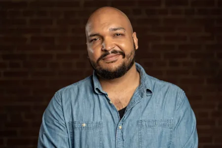 bearded man in a blue shirt