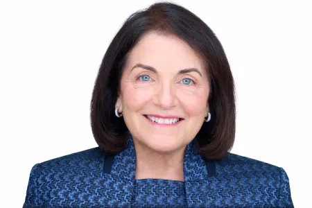 Dark-haired woman wearing blue.