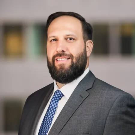 bearded man wearing suit