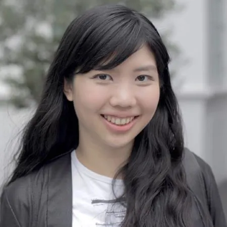 Headshot of Elizabeth Wijaya. Elizabeth is wearing a grey light jacket and white shirt.