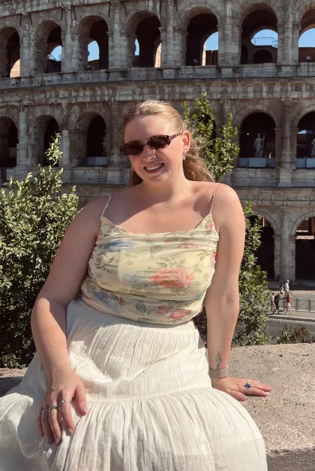 Quinn Moyer in front of the Rome colosseum