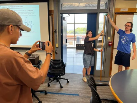 Students measure the coefficient of restitution for a tennis ball with video analysis.