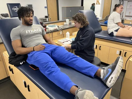 man being seen by an ESAT student