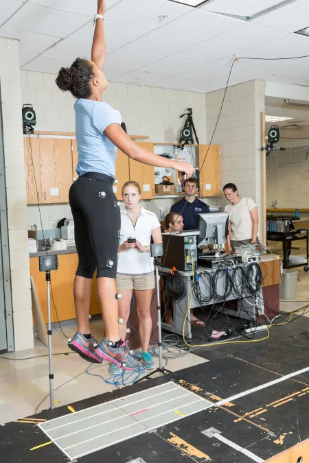 woman testing vertical jumping distance