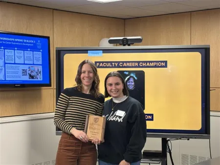 (Dr. Brenton posing with Hope Borsic for a picture)