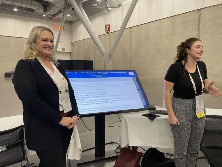 Dr. Rominger & Abby Marracino, M.S. '24, presenting poster at ASHA 2023