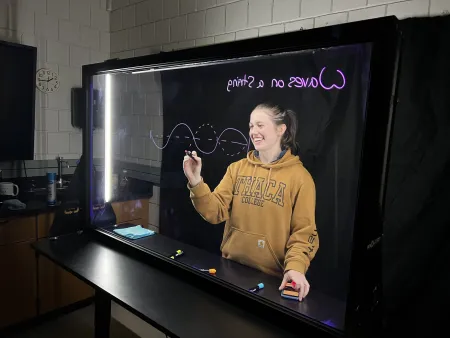 Keely Higgins develops supplementary instructional videos for Physics of Music using a light board in the PER lab.