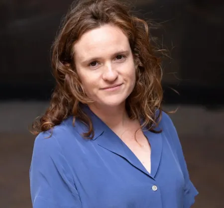 Woman wearing a blue blouse.
