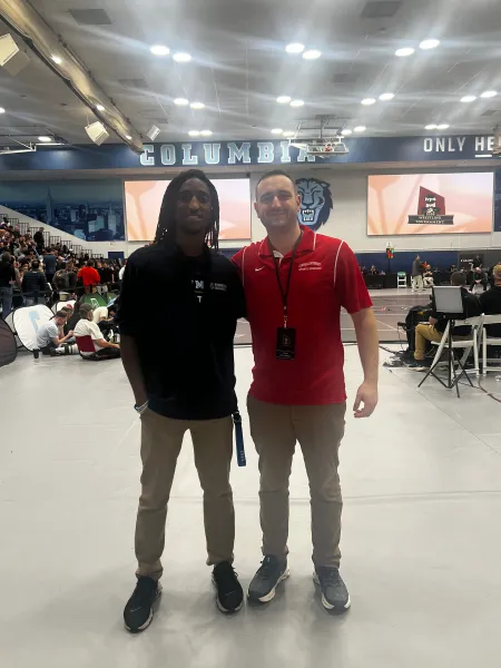 Tim (L) and Nathan (R) posing at Ivy league wrestling tournament