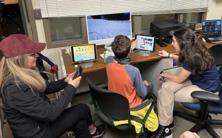 Student clinicians working in the AAC lab