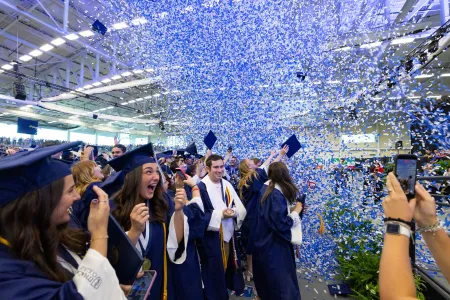 Confetti in the air at a Commencement ceremony.