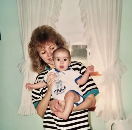 Suzette Moschetti as a baby in IC onsie with her mother.