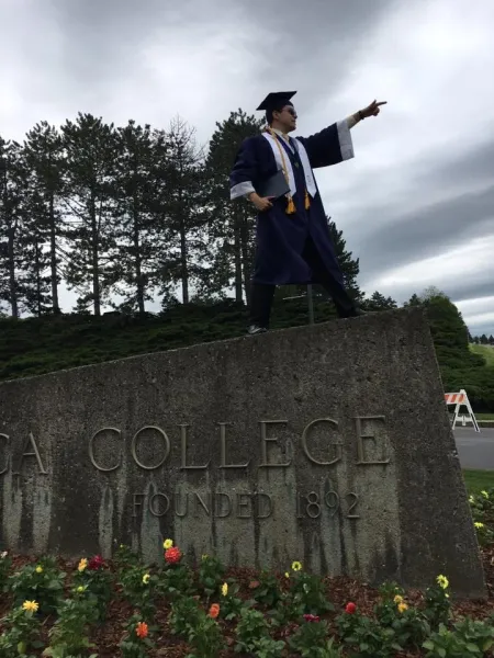 Wisniewski career bound in his cap and gown.