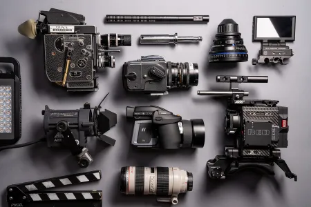 Example of gear available from the Ithaca College Park School of Communications, such as a Red Weapon 8k Camera, multiple lenses (prime and variable focal length) and a hasselblad medium format camera.