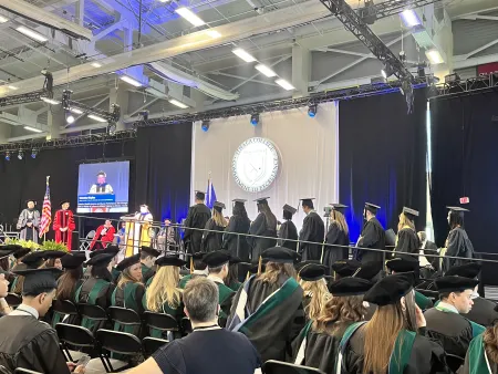 Class of 2026 lining up to receive their diploma