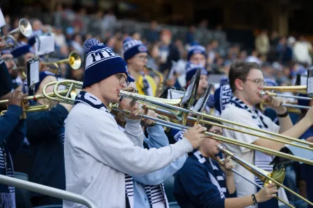 Members of the new IC pep band perform at an athletics event.