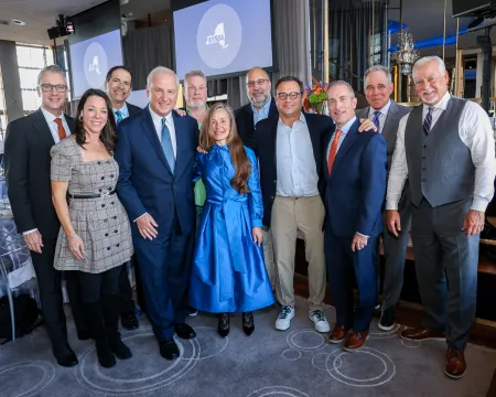 A group photo of staff from a newsroom.