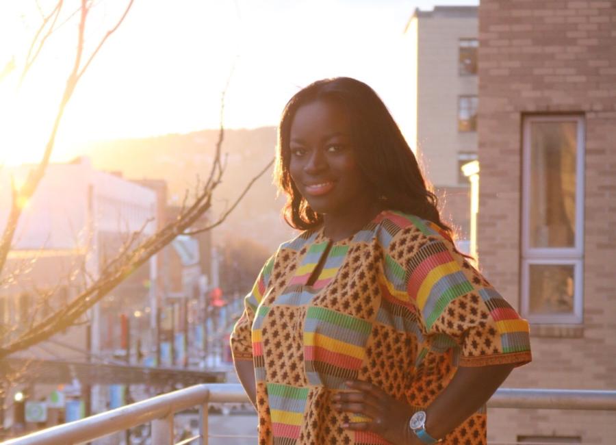 Photo portrait of Ana Coulibaly posing in one of her clothing designs