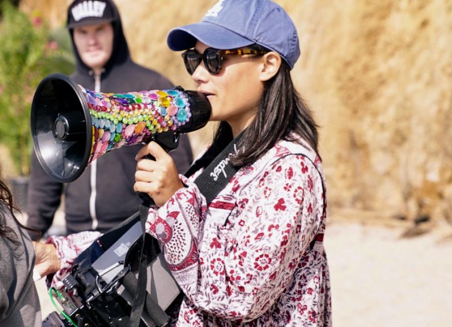 Alumna Aya Tanamura directing on an outdoor film set. 