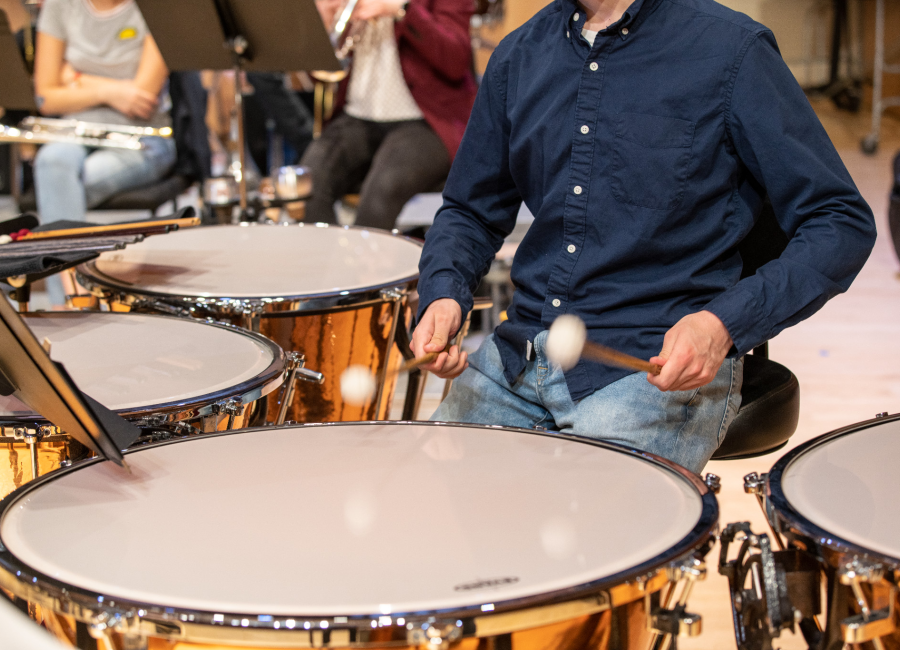 student playing percussion