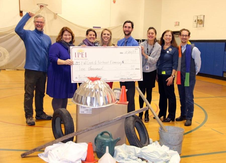 the Reimagining Recess Project team with a large check from IPEI