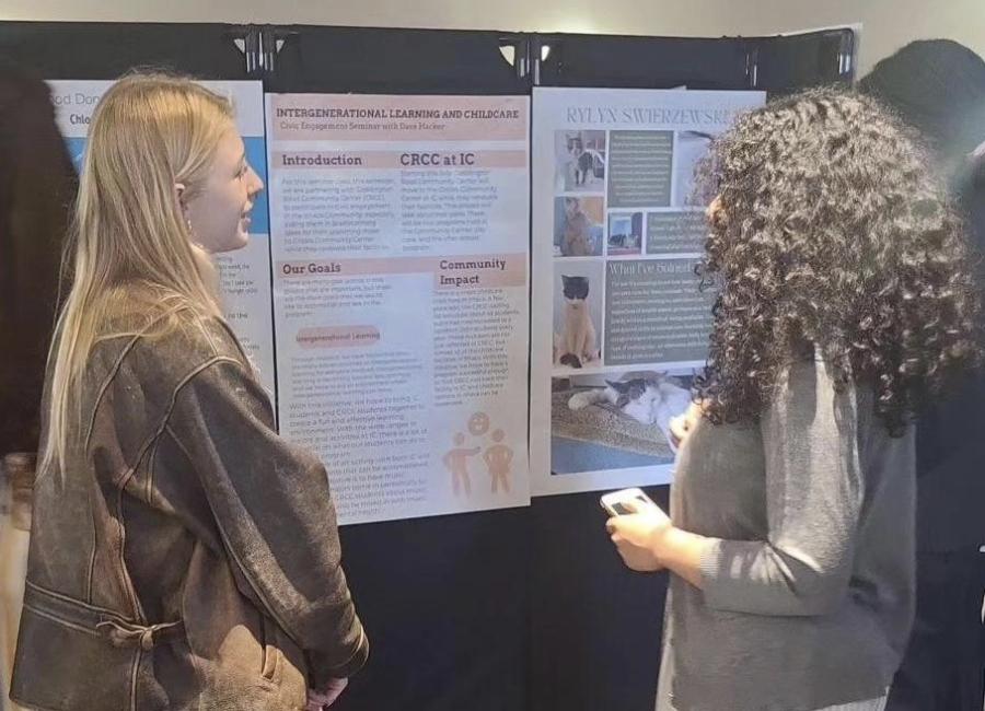 photo of students looking at a flyer