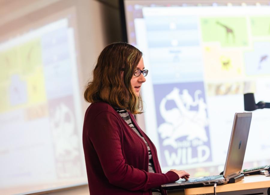a female student using a laptop to give a presentation