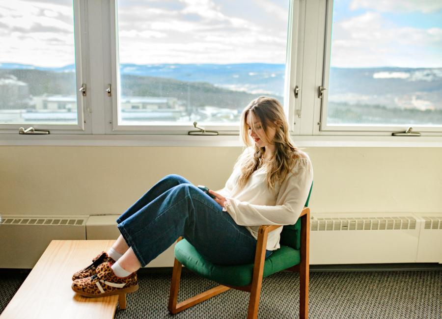 Student relaxes in their room