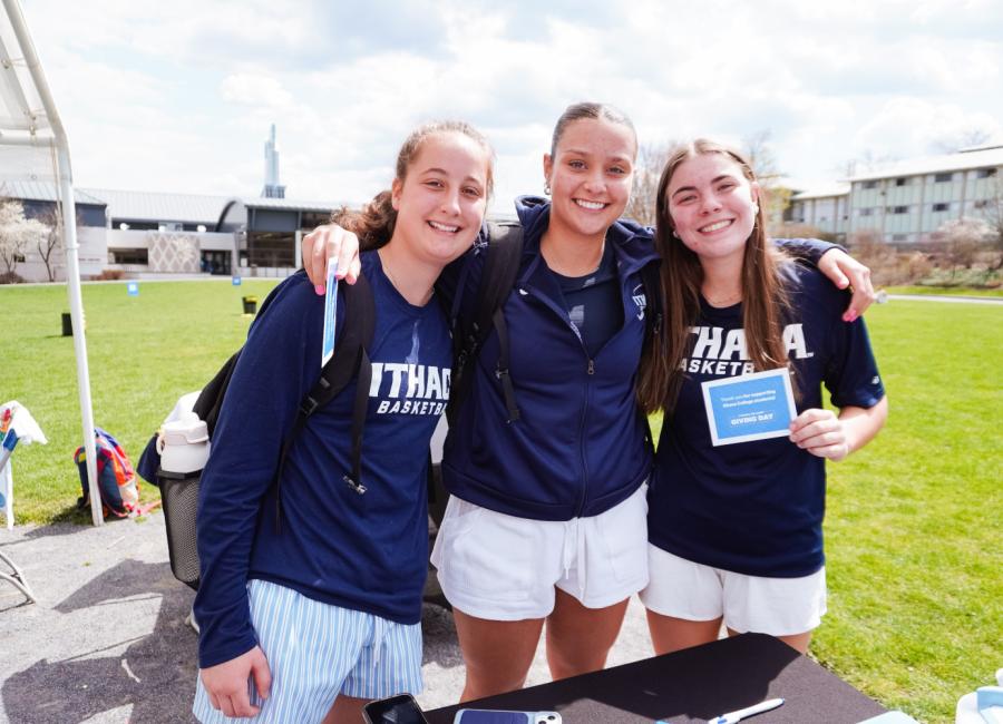 Students celebrate a win by the field