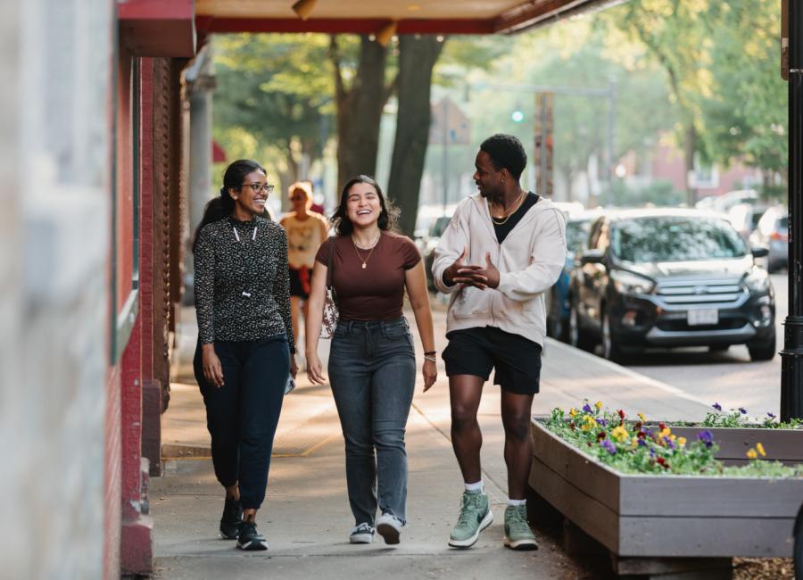 Students enjoy a summer evening in Downtown Ithaca.