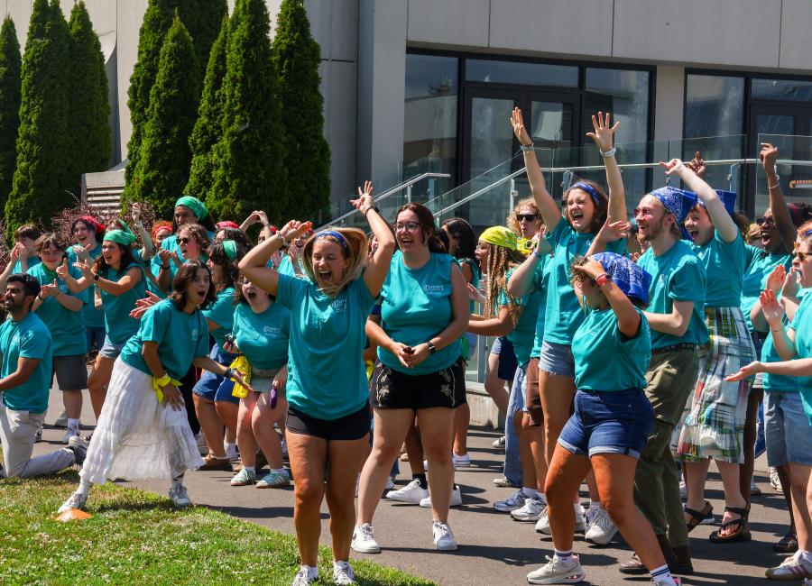 Orientation leaders cheering and celebrating a victory during the Orientation Staff Games Fall 2025