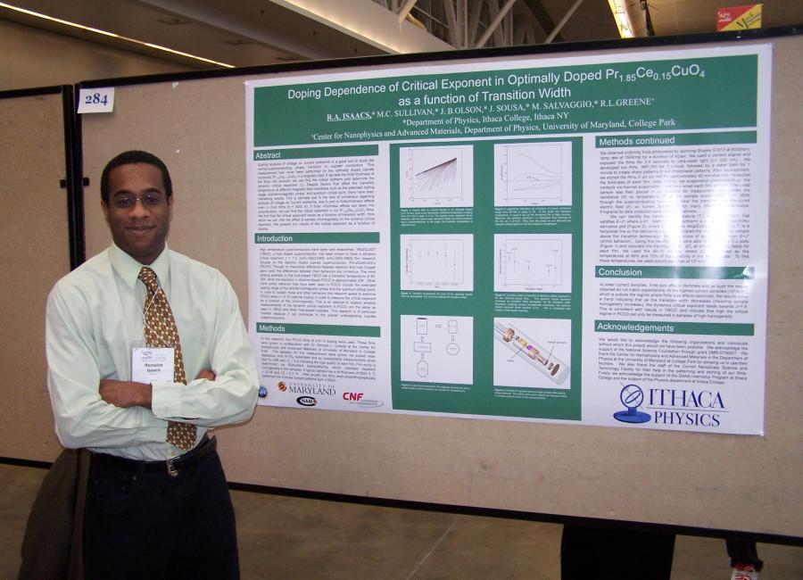 Romaine Isaacs '10 showing a research poster at a conference during his time at Ithaca College.