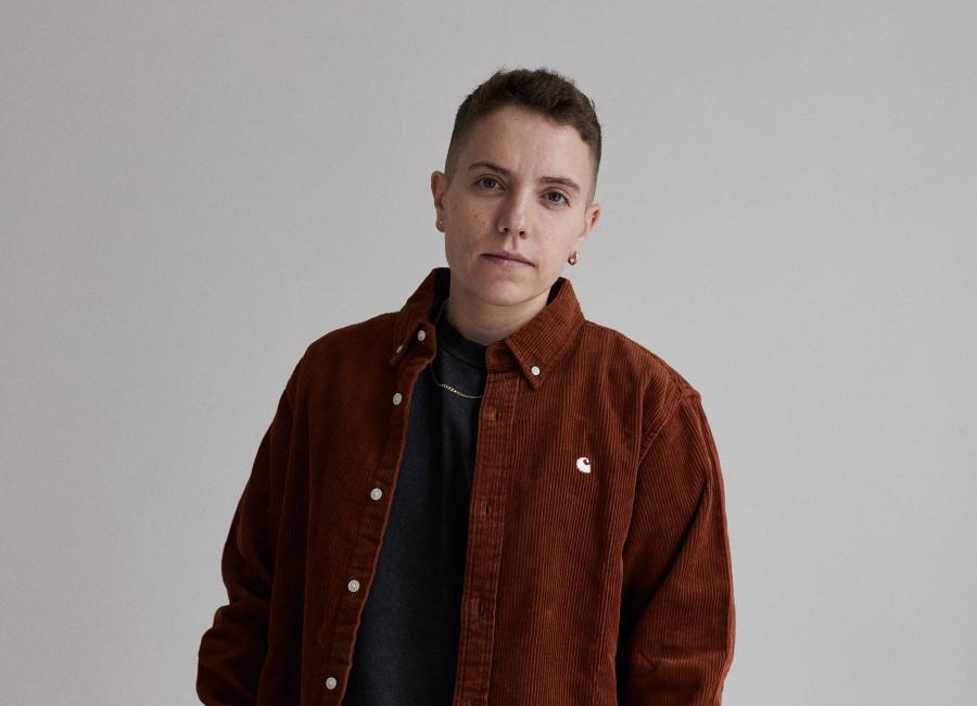 Photo of author standing and looking at the camera.