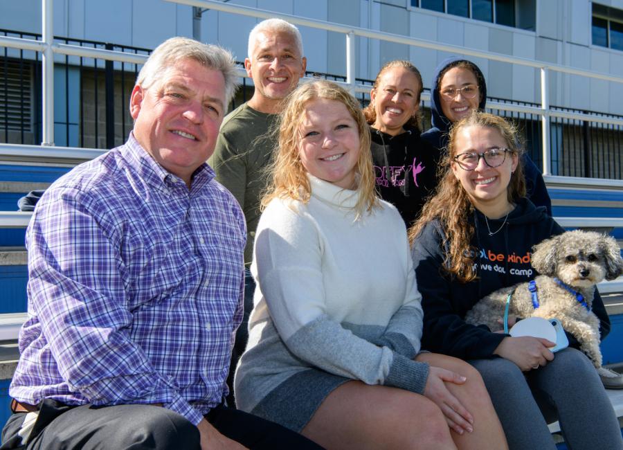 Student with her family during Family Weekend at Ithaca College