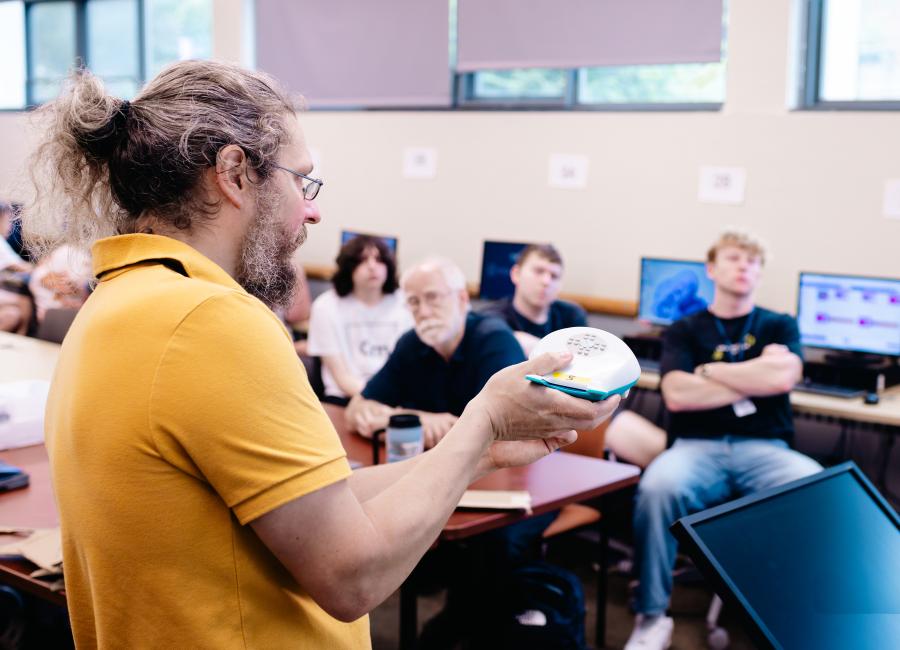 Computer Science Professor John Barr teaches high school students introductory robotics concepts