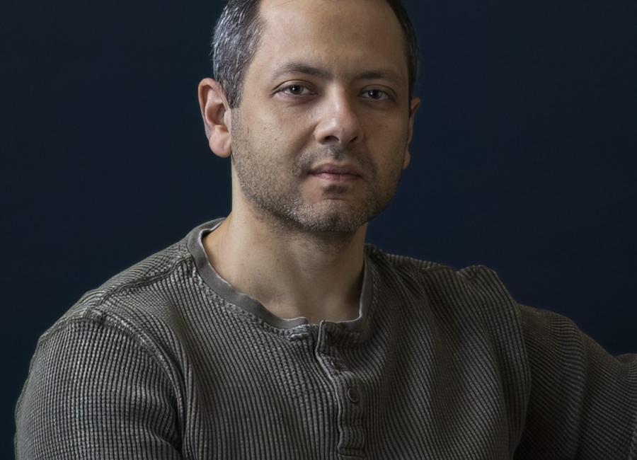 Image of author sitting.