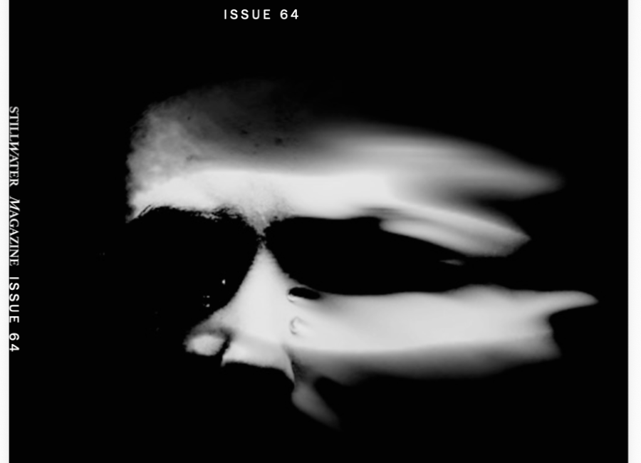Cover of issue 64 with photo of white face on black background