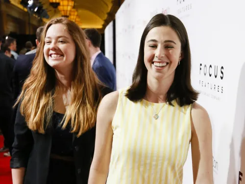 Clara Montague and Eva Kirie smiling at a red carpet event