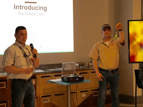 The two inventors of 'Knottie Lock' present the product during a business pitch.