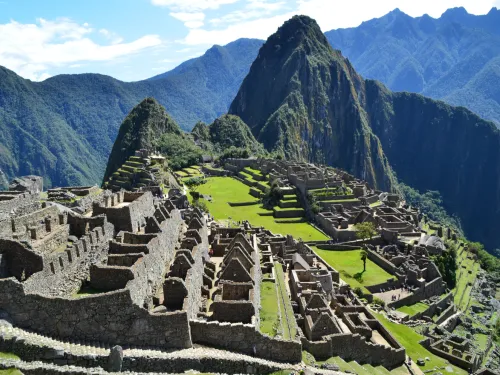 The stone ruins of Machu Picchu with mountains in the background
