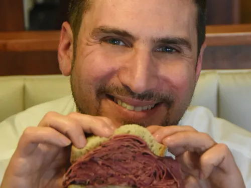 man holding sandwich