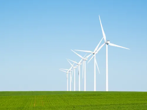 Windmills in a green field