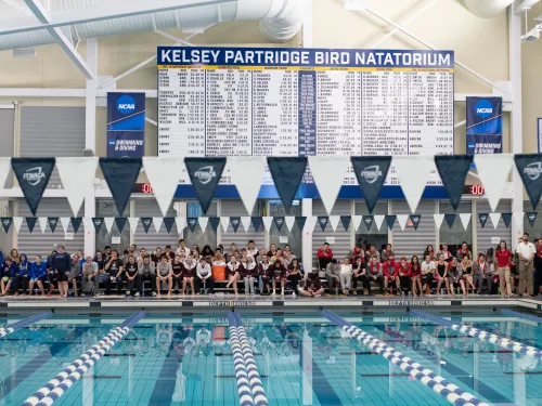 Sign above a swimming pool that says Kelsey Partridge BIrd Natatorium