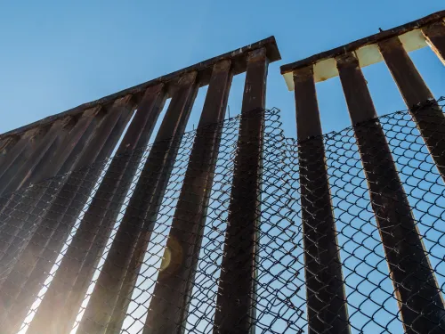 Rusty steel and chain link fence