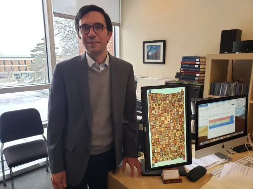 Jorge Grossman with a tapestry