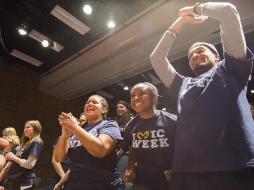 Young people clapping and cheering