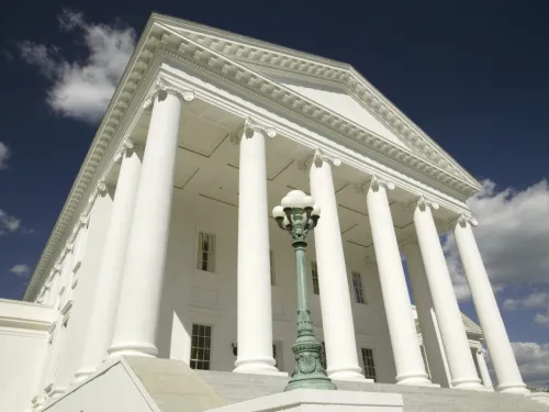 A white Greek style building with columns